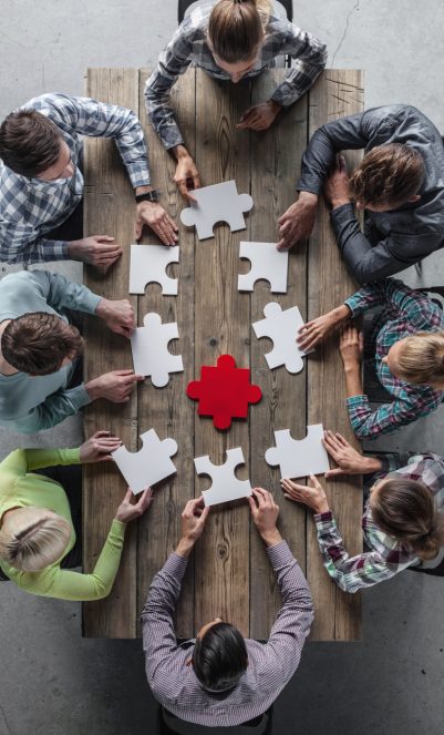 Teamwork meeting concept Hipster business successful teamwork concept, business group assembling jigsaw puzzle